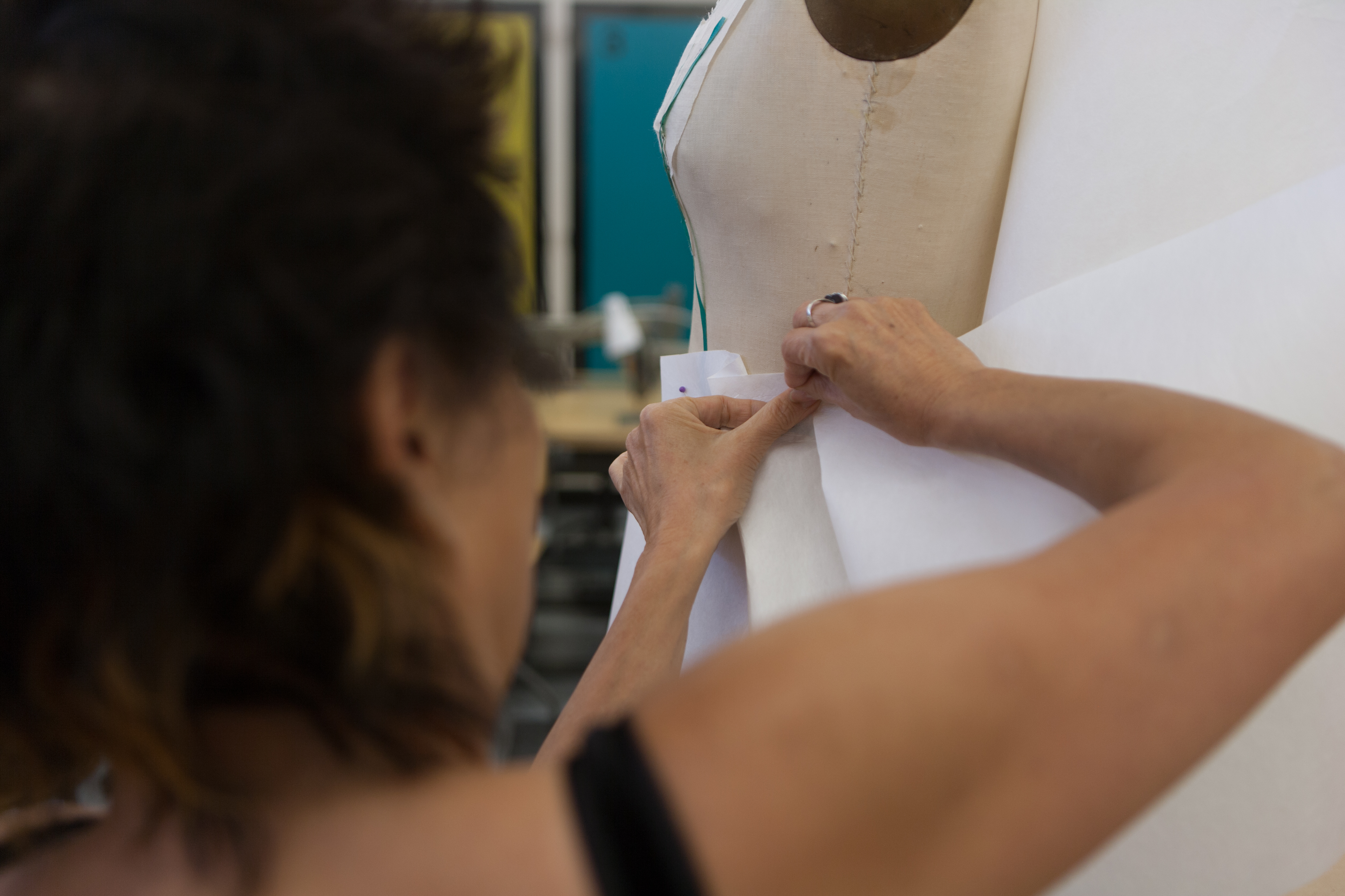 Woman Tailoring on a Mannequin