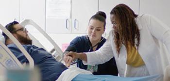Nurses Attending a Patient