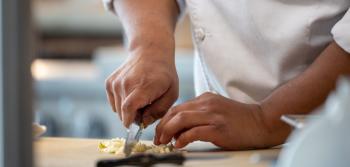 Food being cut on board