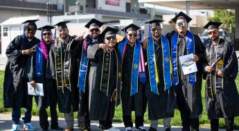 Smiling graduates lined up