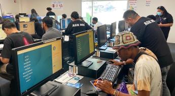 Students receiving help in computer lab