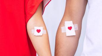 Two arms with heart bandages