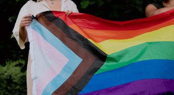 Person holding Pride flag