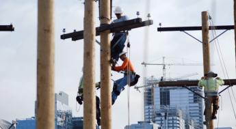 Lineworkers climbing