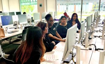 Students getting assistance from counselor