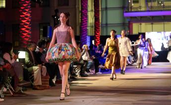 Fashion models walking down runway