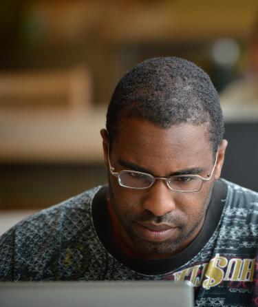 Male Student Watching a Monitor