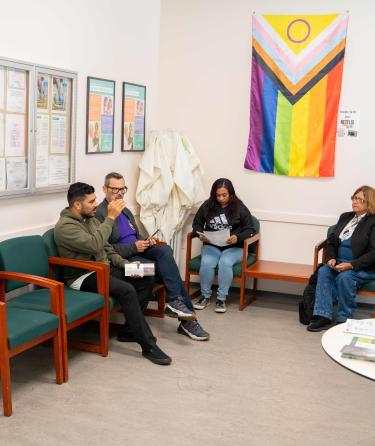 People seated in waiting room of Student Health Center