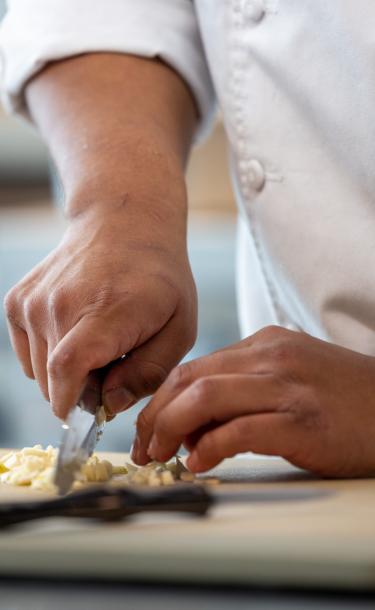 Chef chopping vegetable