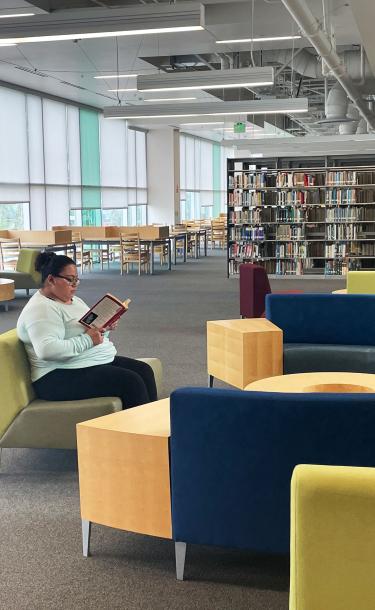 Woman reading in library