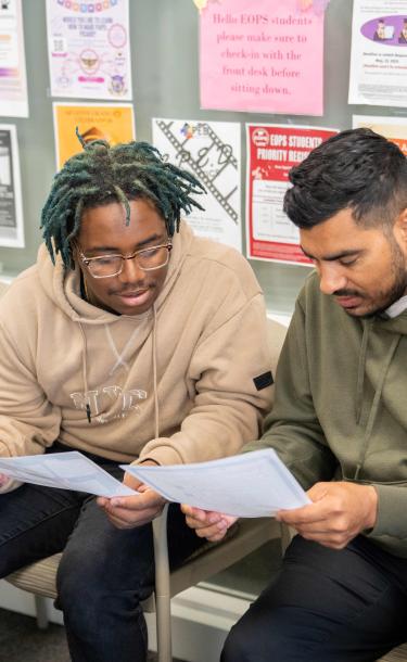 Students reading brochure together