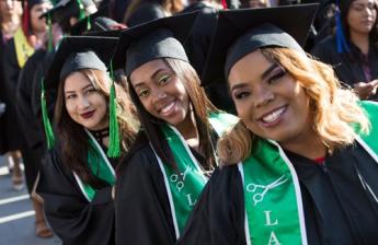 Three Graduated Students Smiling