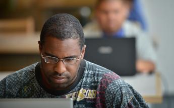 Male Student with a Laptop