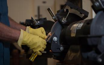 Student Sharpening a Tool