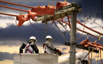 Line-worker on utility pole