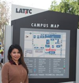 Jolene Gaeta Standing Next to the Campus Map