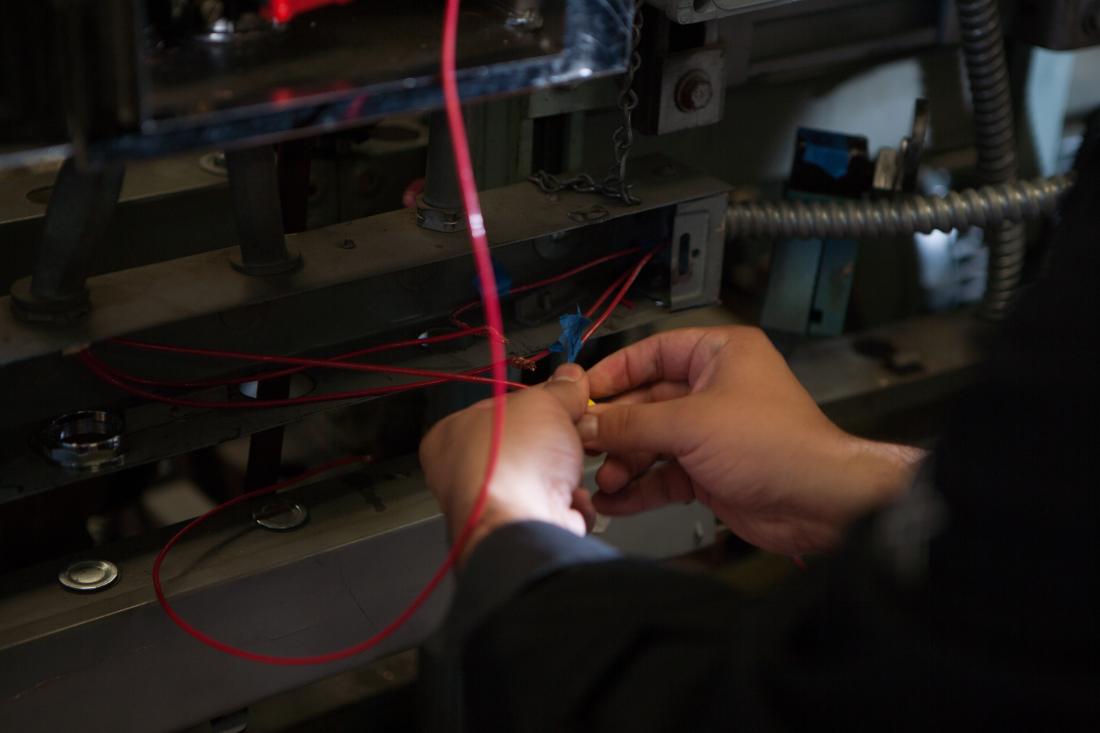 Hands Fixing some Cables