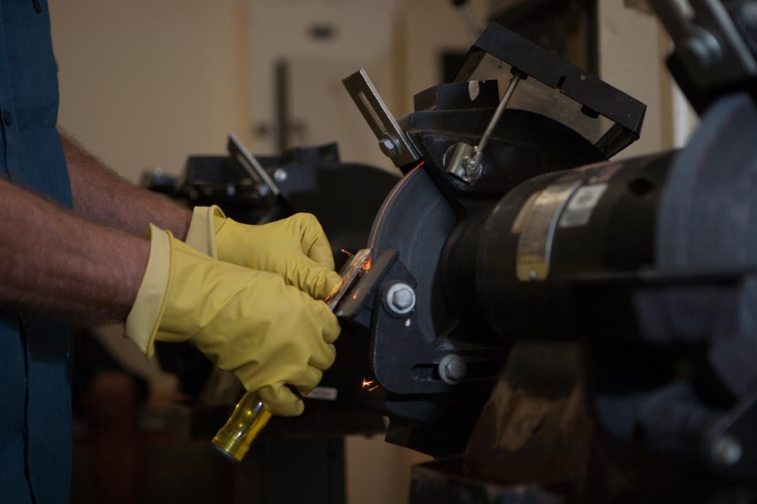 Hands Working with a Machine