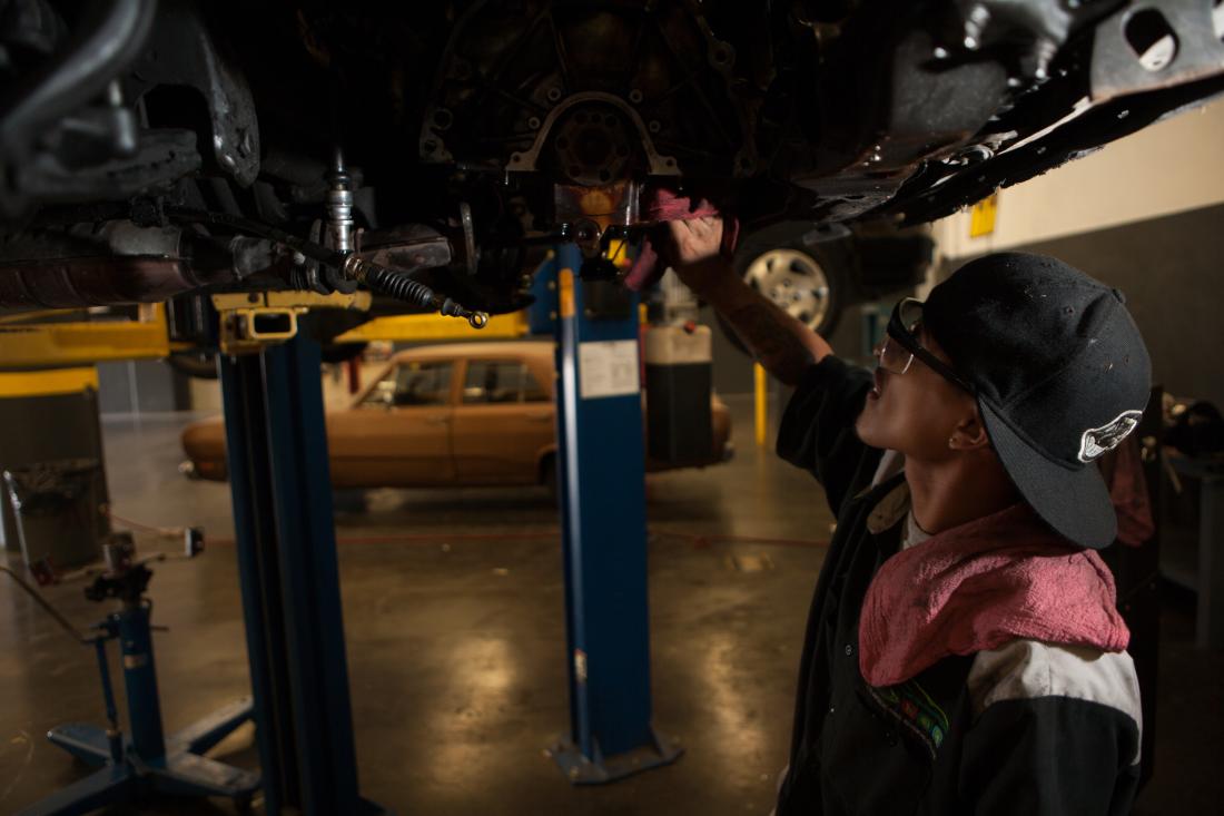 Student Cheking a Vehicle