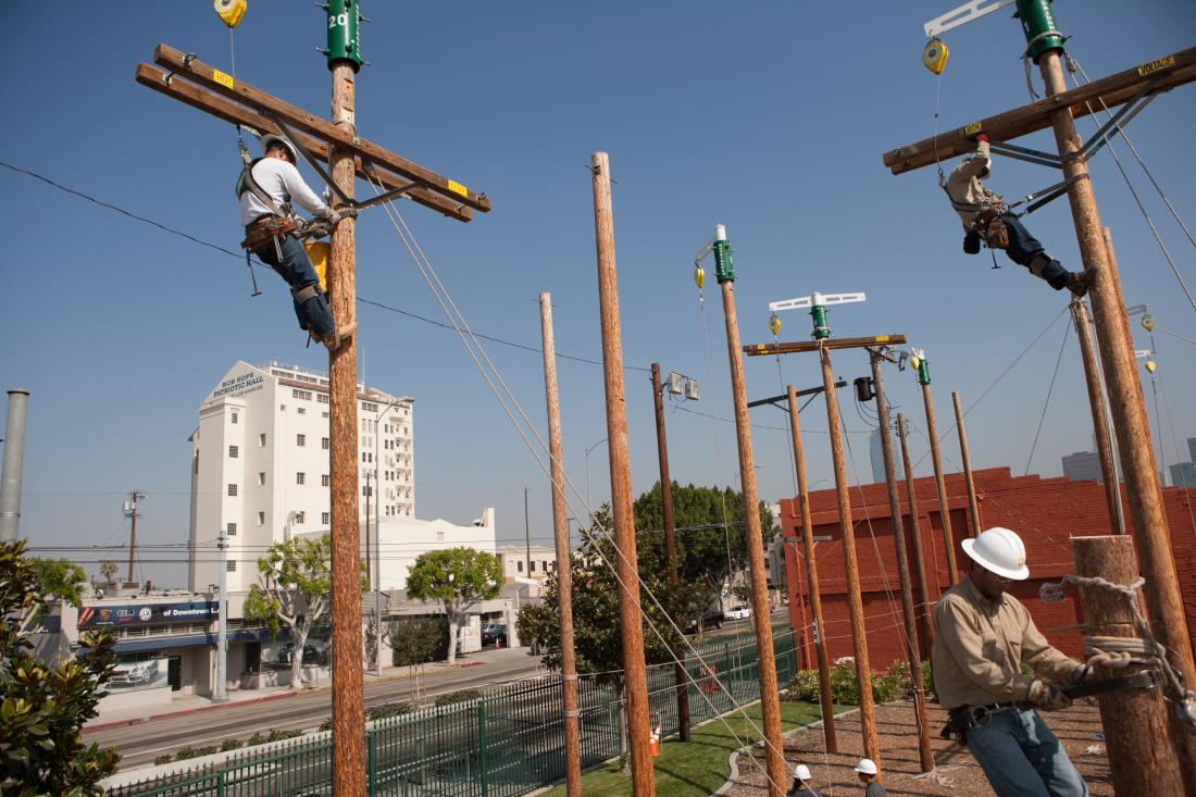 Electricians Working on Light Posts