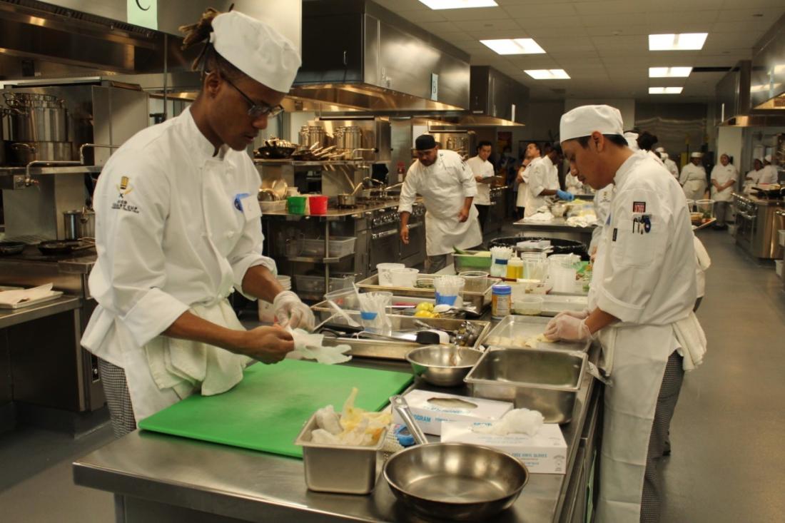 Students working in the kitchen during the final moments of the savory competition