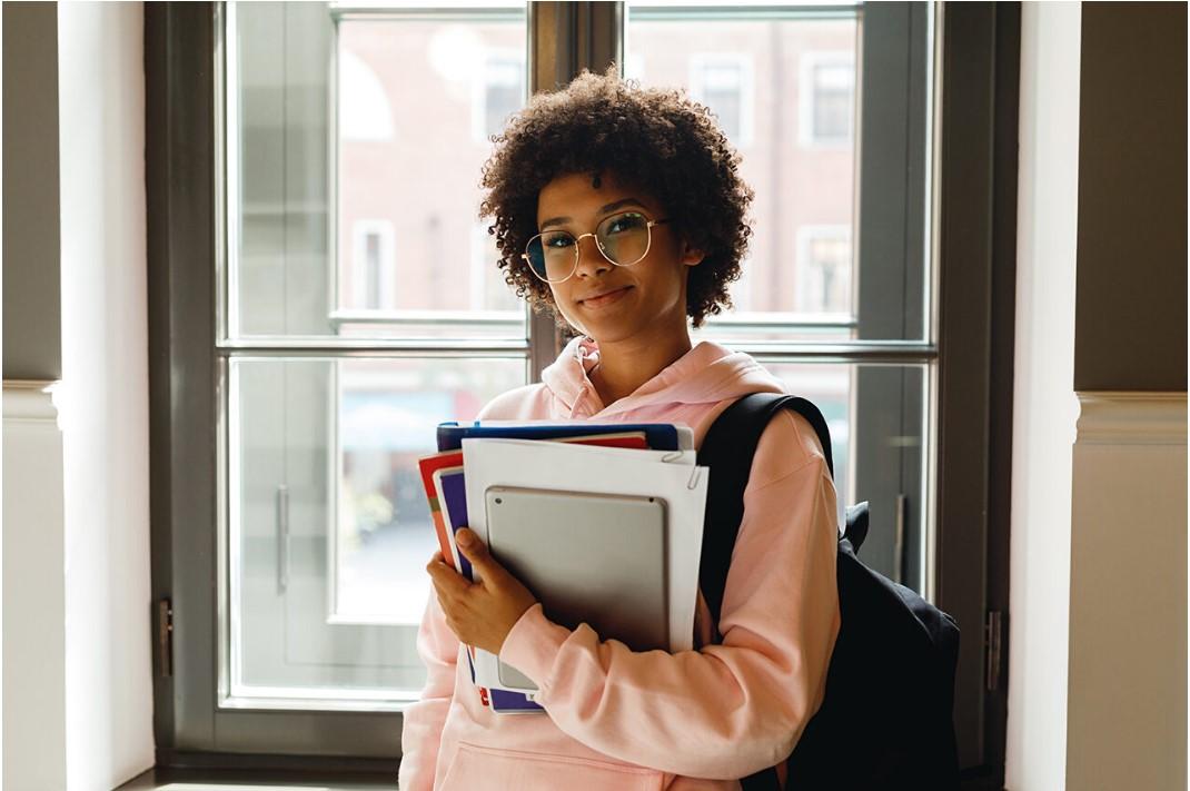 Student holding books