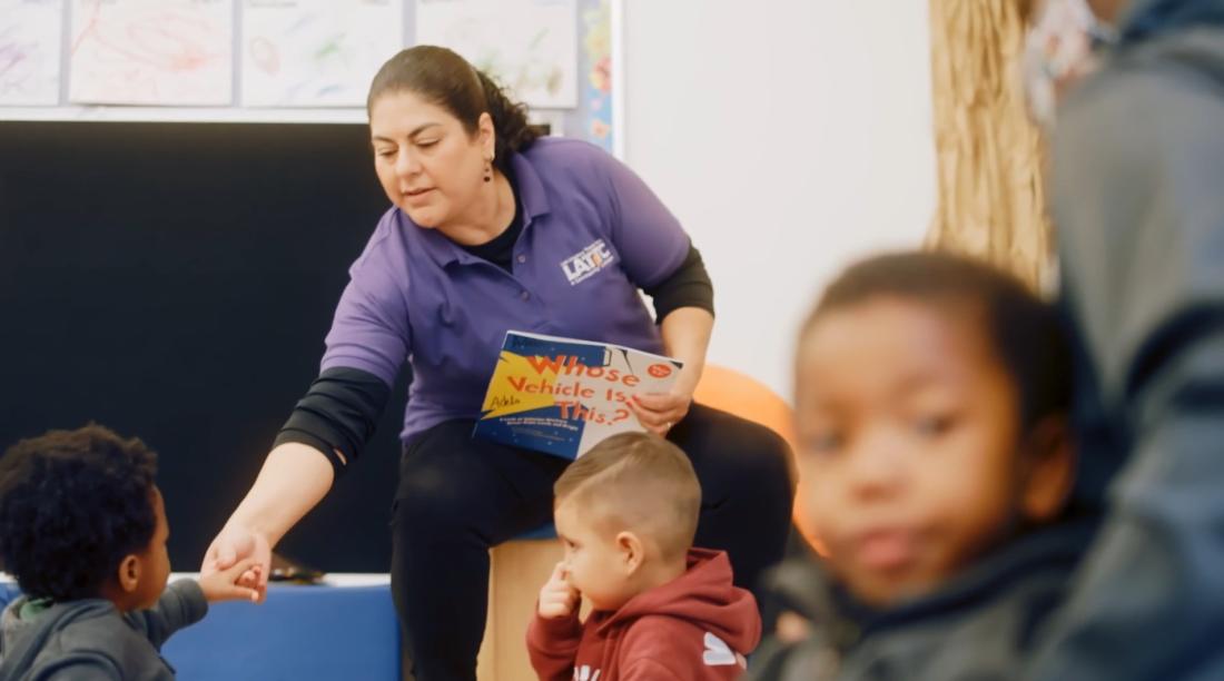 Teacher reading to children