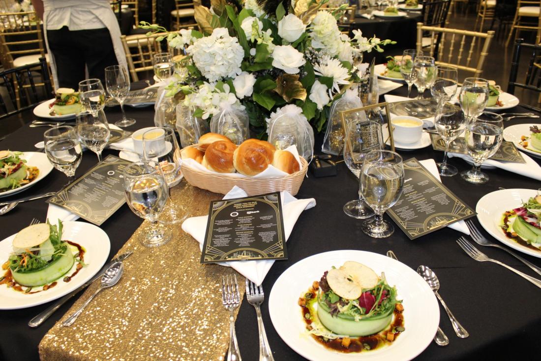 Table spread with flowers and food