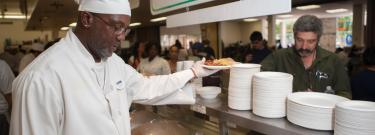 Cook Serving Food